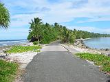 tuv10 The eastern part of the atoll is at times so narrow that the road takes most of its width. Here, looking south, the ocean is on the left and the lagoon on the right.